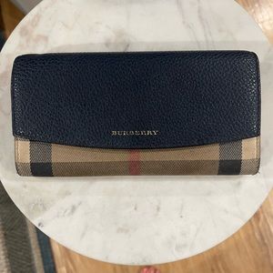 Burberry Continental Wallet.Zipper works great.Navy blue.Soft leather.